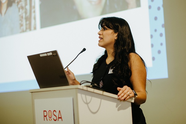Woman speaking from a podium.