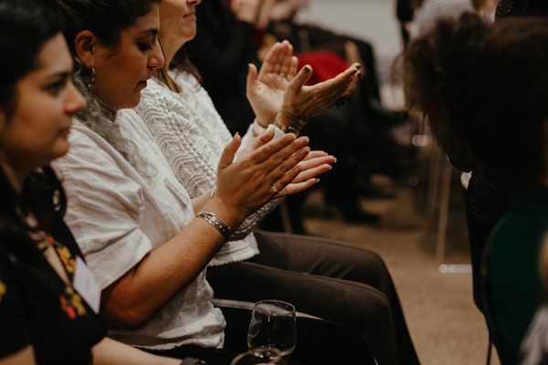 women applauding