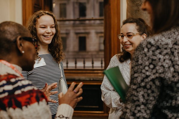four women in conversation